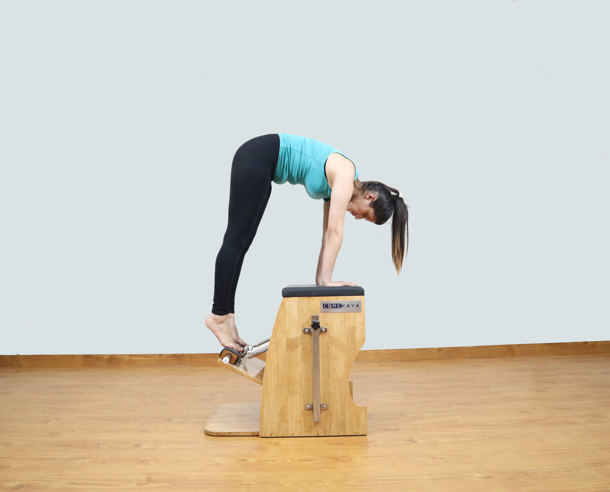 CoreKaya Pilates Wunda Chair - A versatile and ergonomic fitness chair for all levels.